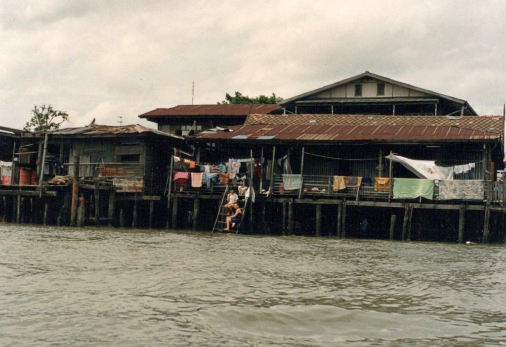A photo of the 'old town' district of Bangkok from a long-tail boat on the Chao Phraya River.