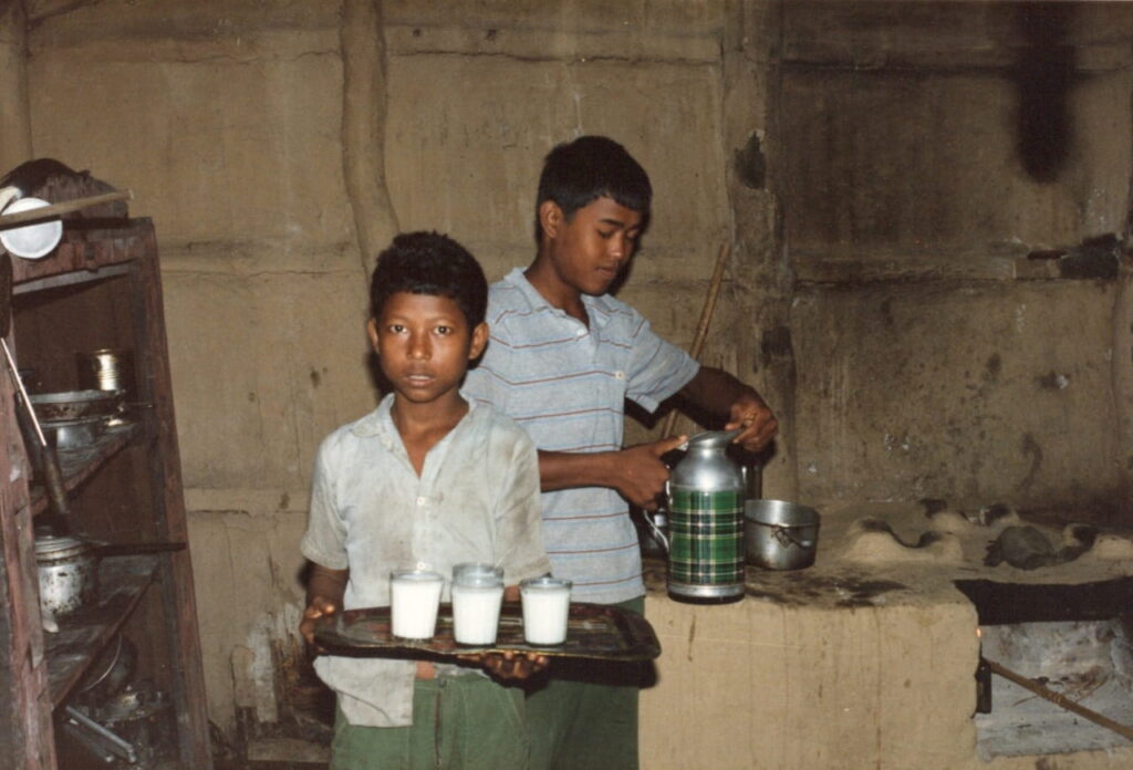 Our restaurant waiters, Shomlal and Kamal serving our powered milk drinks - Chitwan National Park, Nepal.